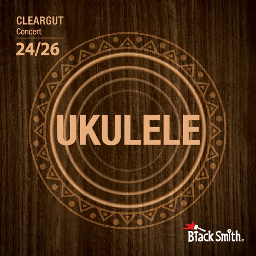 BlackSmith Cleargut-strengepakke merket Concert, med stor ukuleletekst på mørk trebakgrunn